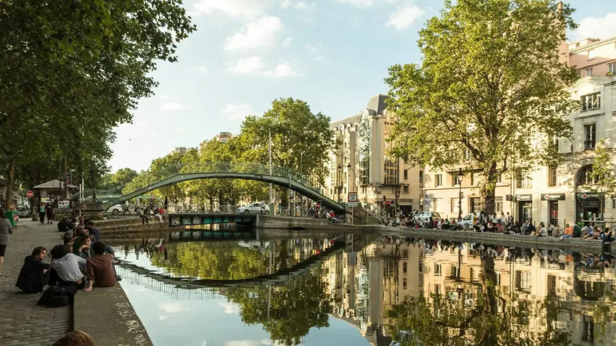 People enjoying the evening in Canal Saint-Martin, Paris