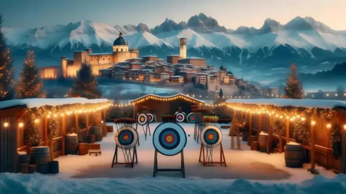 targets set up outside in a snowy wintery setting, with a town and mountains in the background