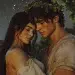 Ariadne, a Greek princess with dark hair and wearing a worn out weathered white dress embraces Dionysus, a young handsome god wearing a crown of leaves and a dirty worn out white tunic