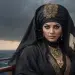 Close-up portrait of Sayyida al-Hurra, the feared pirate queen of Morocco, standing on the deck of a ship at sea. She wears a dark embroidered cloak with gold trim, a jewelled headscarf, and piercing eyes that scan the horizon.