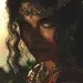 Close up portrait of Lamia, legendary queen of Libya before her curse, breathtaking beauty with long dark hair and glowing skin, regal expression and powerful presence, delicate gold crown and jewelry