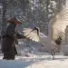 A poor Japanese villager freeing a white crane caught in a hunter’s trap in a snowy forest, the graceful crane spreading its wings as the man gently removes the snare
