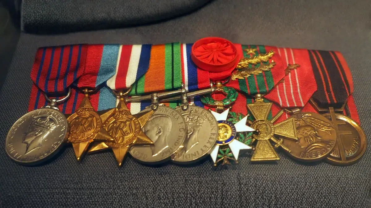 colourful medals displayed on a war jacket